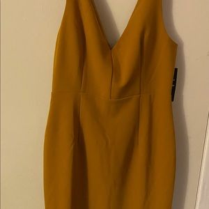 Mustard yellow bodycon midi dress.